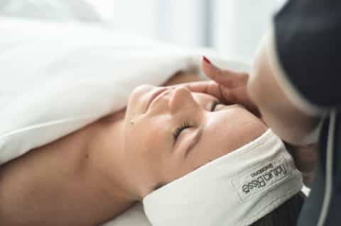 Spa therapist performing a relaxing massage on a client