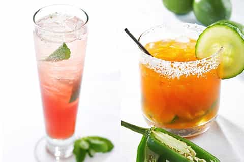 Two tropical cocktails: a pink drink with mint and ice, and an orange margarita with salt rim and cucumber slice