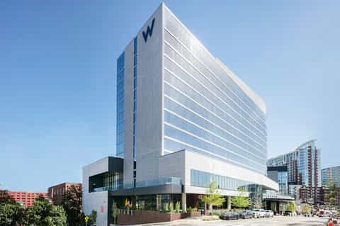 Modern white W Hotel building exterior with contemporary architecture and street-level entrance