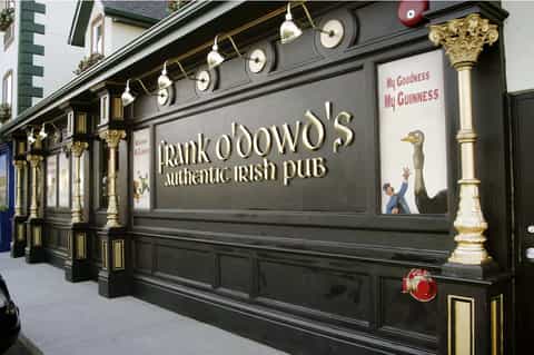 Frank O'Dowd's Authentic Irish Pub storefront with dark facade and brass details