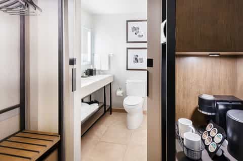 Contemporary bathroom with walk-in shower, vanity sink, and modern fixtures