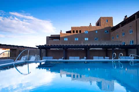 Geometric pool at a modern resort with architecture building and blue sky