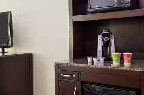 In-room coffee maker and beverage station with TV and granite countertop