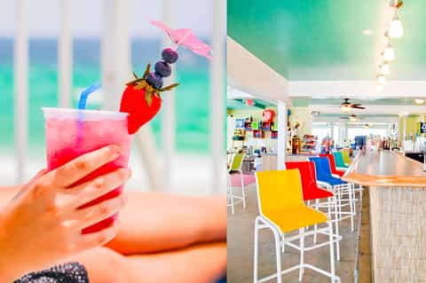 Colorful tropical cocktail with fruit garnish and vibrant bar seating area with ocean view