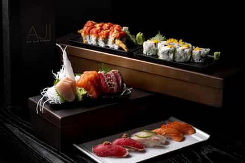 Elegantly plated sushi and sashimi dishes at AJI bar and robata restaurant