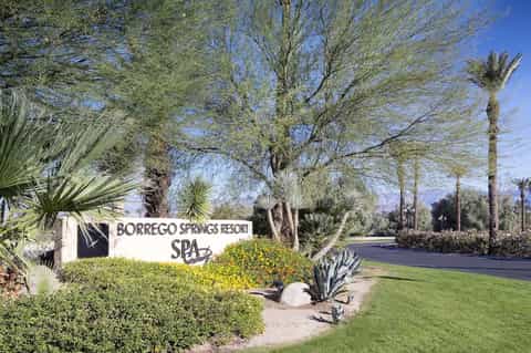 Borrego Springs Resort Spa entrance sign with desert landscaping and palm trees
