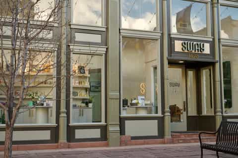 Modern storefront with glass windows and minimalist signage for Sway restaurant