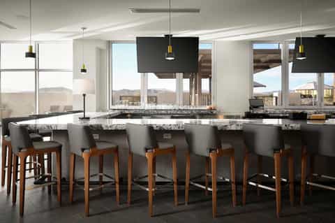 Modern bar lounge with granite countertops, wooden bar stools, panoramic windows with mountain views