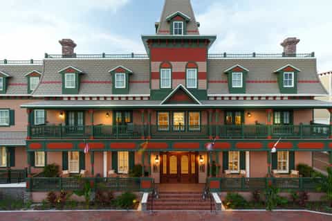 Historic Victorian-style hotel exterior with red and green architecture