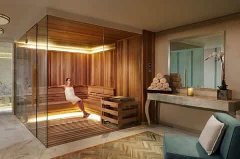 Luxury spa sauna room with cedar wood paneling and ambient lighting for relaxation