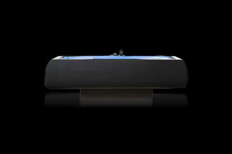 Sleek black and blue hydrotherapy bath tub against black background, product photography