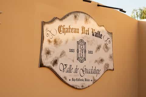 Chateau Del Valle estate plaque on terracotta wall in Valle de Guadalupe, Baja California, Mexico