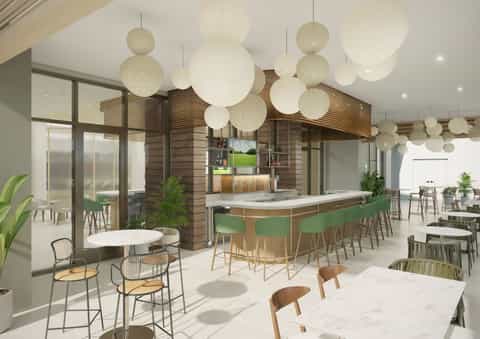 Contemporary hotel lounge with spherical pendant lights, wooden kitchen island, green bar seating, and dining tables
