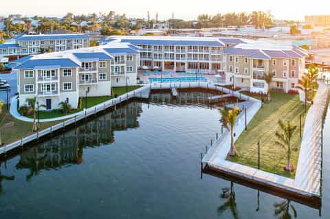 Waterfront residential development with modern buildings and boat docks