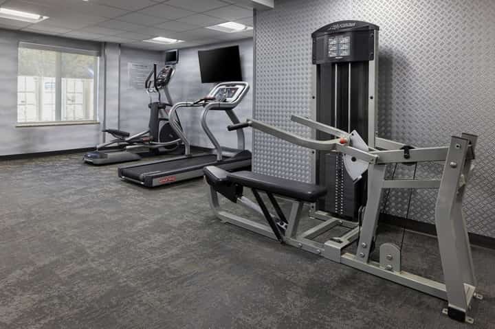 Fitness center with cardio equipment including treadmill and elliptical machine