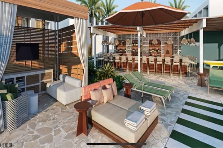 Modern resort pool area with cabanas, umbrellas, bar seating, and beach lounge furniture
