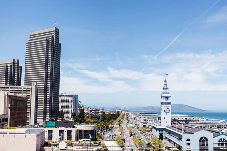 San Francisco cityscape featuring Ferry Building clock tower and bay waterfront view