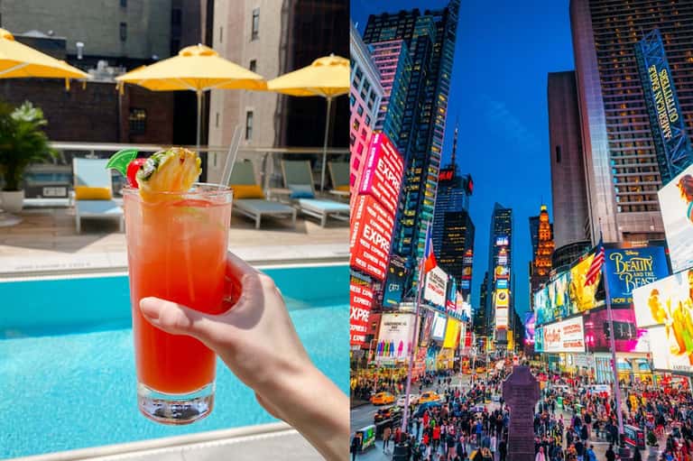 Tropical cocktail by pool with yellow umbrellas and Times Square cityscape at dusk