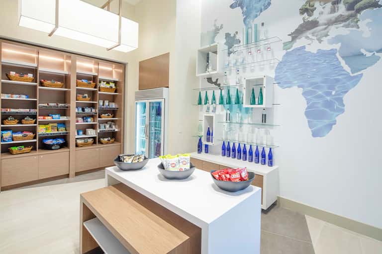 Contemporary retail space with wooden shelving, product displays, and world map wall decoration