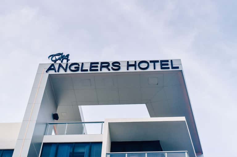 Anglers Hotel exterior signage on modern white building facade