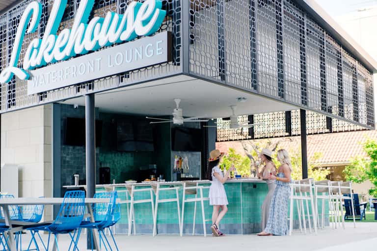 Lakeshore Waterfront Lounge exterior with turquoise bar counter and blue seating