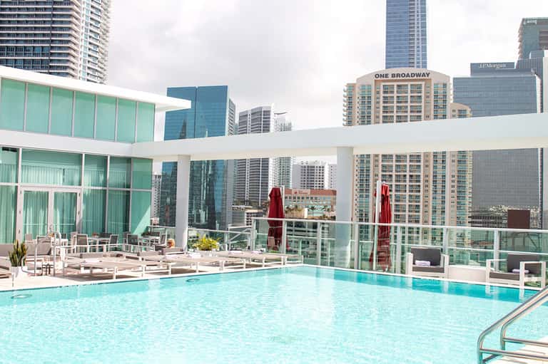 Rooftop infinity pool with city skyline views and modern architectural design