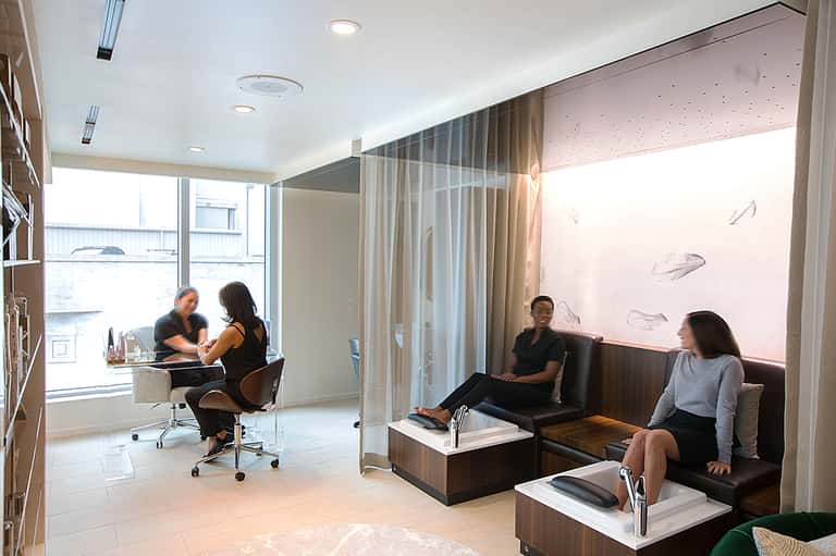 Contemporary spa lounge with modern seating areas and floor-to-ceiling windows