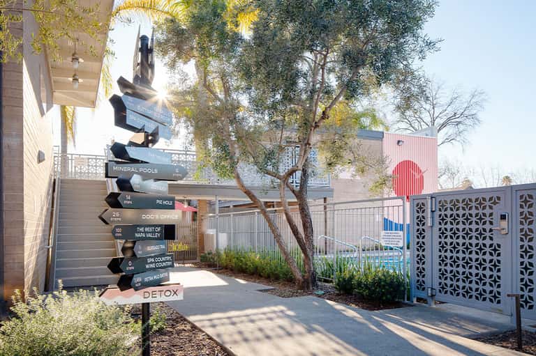 Directional signage for spa, detox, and wine country at a modern resort wellness facility