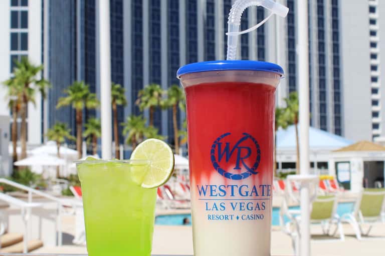 Poolside drink with lime garnish at Westgate Las Vegas Resort Casino with city towers