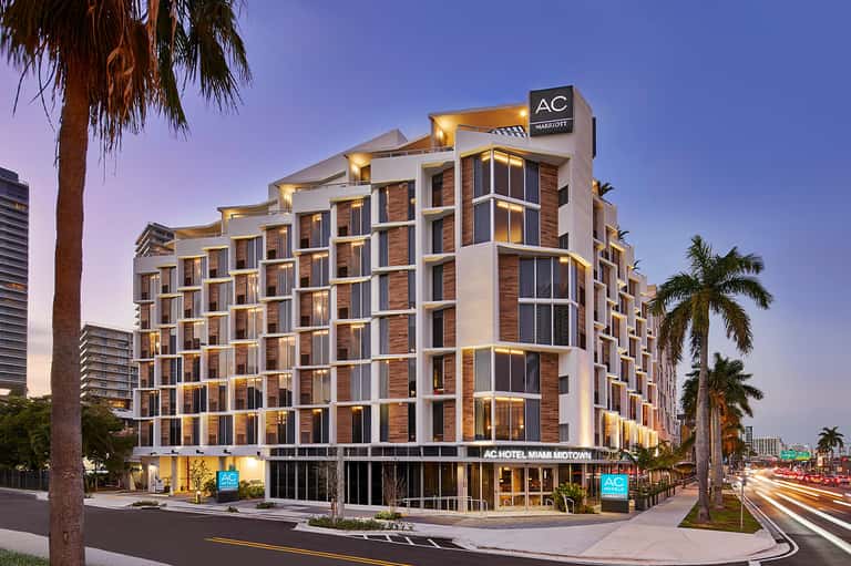 Modern AC Marriott hotel building exterior with contemporary architecture at dusk