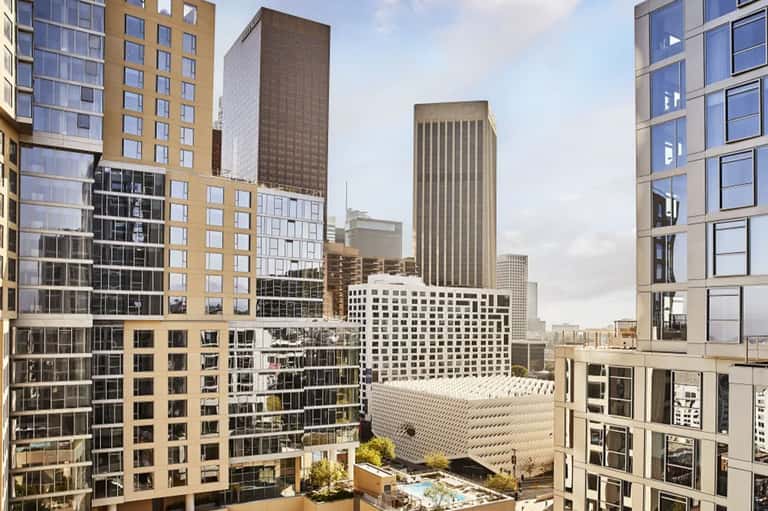 Downtown city skyline view showing mixed residential and office towers with modern architecture