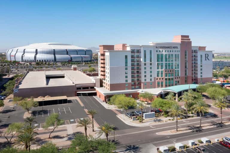 Modern hotel complex with Renaissance hotel and adjacent sports arena in desert landscape