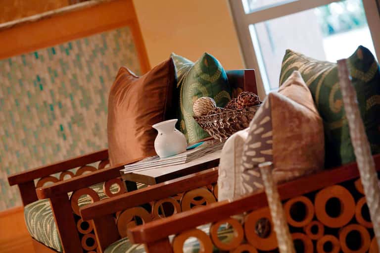 Decorative pillows and room details with warm earth tones and patterned fabrics