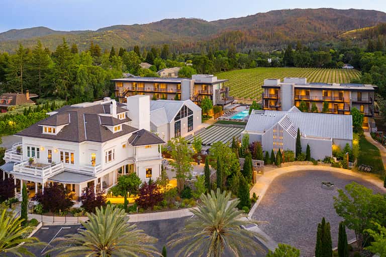 Luxury vineyard resort aerial view with contemporary architecture and mountain landscape