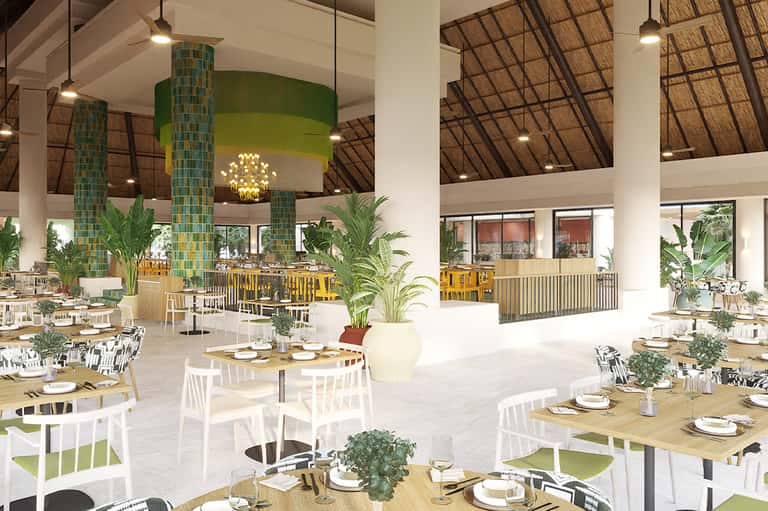 Modern resort dining room with high ceilings, green accent pillars, and round tables