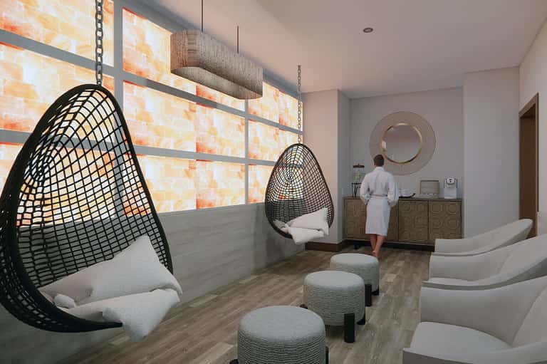 Modern spa relaxation room with hanging egg chairs and pendant lighting