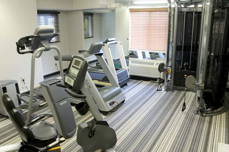Fitness center with cardio equipment, treadmills, and exercise machines