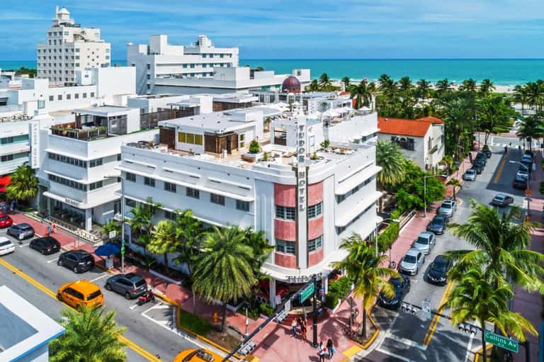 Beachfront hotel in Miami with Art Deco architecture and turquoise ocean