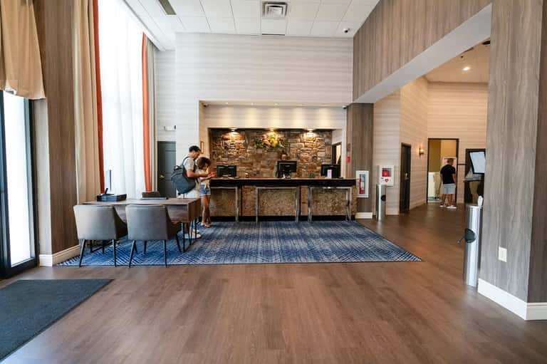 Modern hotel lobby with check-in desk and contemporary design