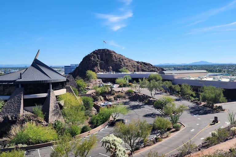 Desert museum campus with modern architecture, rocky hilltop, and landscaped grounds