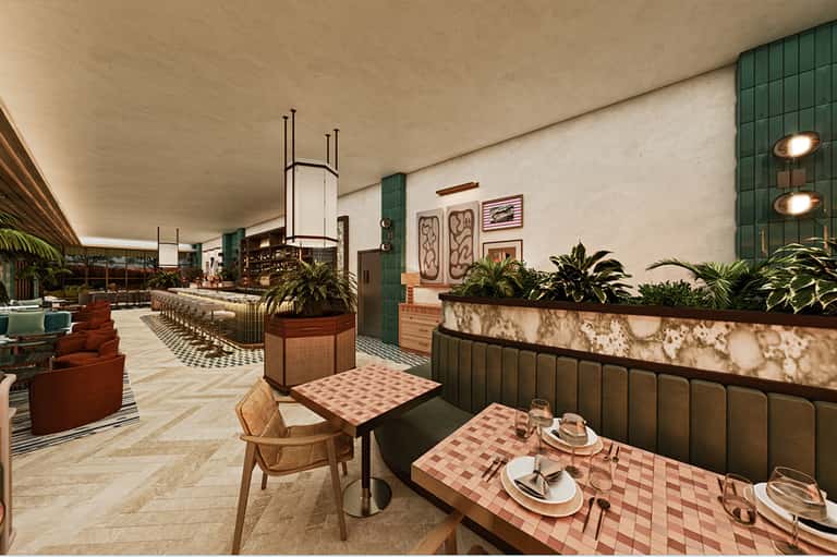 Modern restaurant dining area with green banquettes, pink checkered tables, and potted plants along the walls