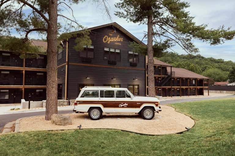Vintage white station wagon parked in front of The Ogarker Lodge building