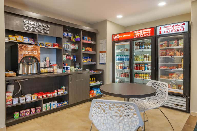 Candlewood Cupboard convenience store with refrigerated beverages and snacks