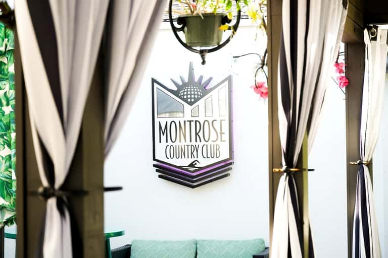 Montrose Country Club entrance with white curtains and hanging plants
