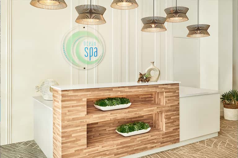 Modern spa reception desk with Ocean Spa sign and wooden fixtures
