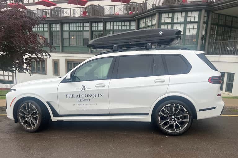 White BMW SUV branded with The Algonquin Resort name parked at luxury Scottish resort entrance