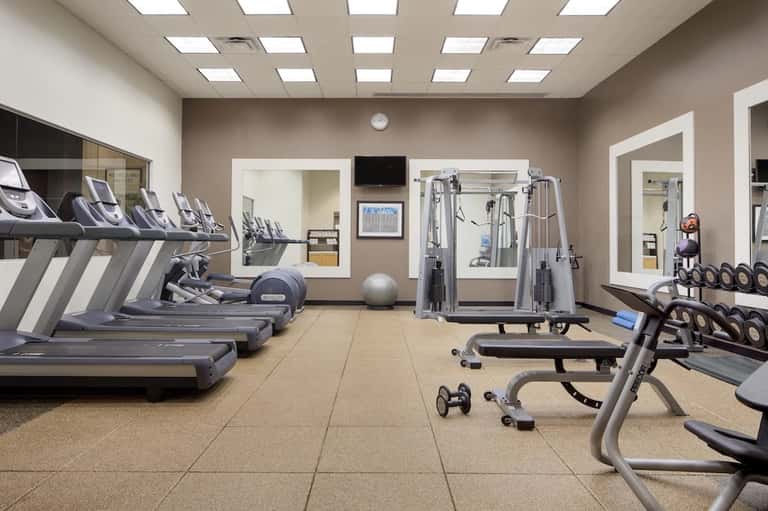 Well-equipped fitness center with treadmills, weights, and exercise machines