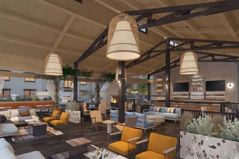 Modern outdoor resort lounge with woven pendant lights, wood beams, seating areas, bar, plants, and contemporary furnishings