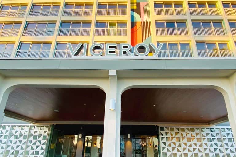 Viceroy hotel exterior with yellow façade, balconies, and modern architecture