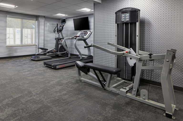 Fitness center with cardio equipment including treadmill and elliptical machine